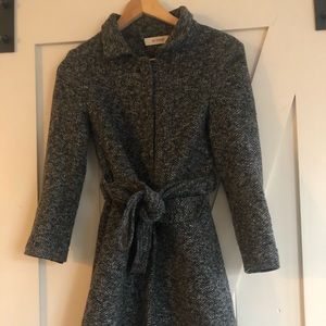 Black and white tweed coat.